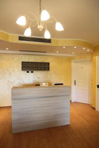 a large lobby with a reception desk in a building at Monte San Giovanni-Nebrodi Rooms in San Marco dʼAlunzio