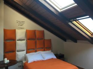 En eller flere senger på et rom på Il Trattore