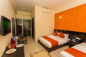 Krevet ili kreveti u jedinici u okviru objekta Tuki Resort Pokhara
