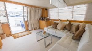 a living room with a couch and a table at Riti Yacht in Kalkara