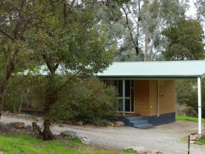 a house with a tree in front of it at Watervale Retreat in Watervale