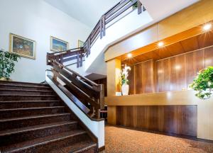 a staircase leading up to a stair case at Hotel Al Posta in Casarsa della Delizia