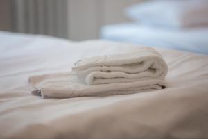 Łóżko lub łóżka w pokoju w obiekcie Grand Soho Apartment