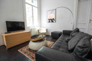 Telewizja i/lub zestaw kina domowego w obiekcie Grand Soho Apartment