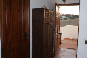 a hallway with an open door and a room with an open door at Appartement Miradorgolf in Cabo Negro +47 photos
