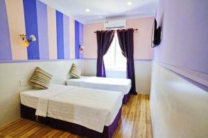 Giường trong phòng chung tại Q Songchi Hotel
