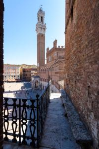 a view of a building with a clock tower at La Terrazza Sul Campo-Rooms Only - NO reception in Siena