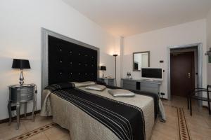 Posteľ alebo postele v izbe v ubytovaní Hotel Corallo