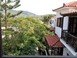 a view from the balcony of a house at Anofli Suites in Skopelos Town