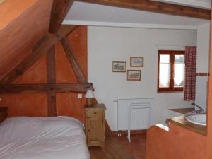 Postel nebo postele na pokoji v ubytování Gites Les Petits Tisserands