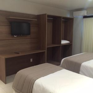 Postel nebo postele na pokoji v ubytování Hotel Maua