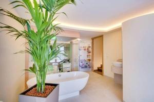 Koupelna v ubytování R&R Residenzen Aparthotel + 37 fotografií