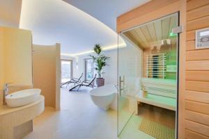 Ein Badezimmer in der Unterkunft R&R Residenzen Aparthotel