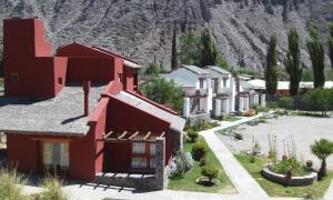 arial view of a resort with mountains in the background at El Refugio de Coquena in Purmamarca