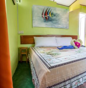 Postel nebo postele na pokoji v ubytování Merlin Guest House