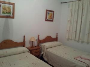Postel nebo postele na pokoji v ubytování Los Olivos