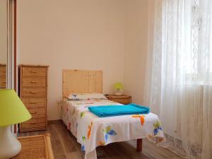 A bed or beds in a room at A Casa Di Clementina