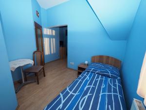 Кровать или кровати в номере Penzion U Krejzů