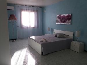 Postel nebo postele na pokoji v ubytování Il Gelsomino