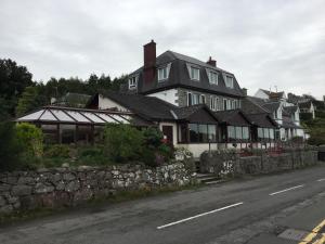 a large house on the side of a road at The Mariner Hotel in Kippford