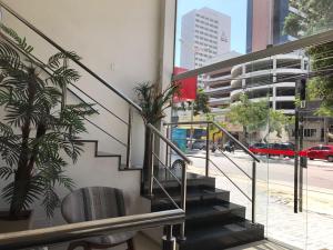 a staircase in a building with potted plants at Abolição Praia Hotel in Fortaleza