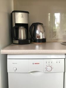 a coffee maker and a toaster on a kitchen counter at Apartament KORAB Władysławowo-Cetniewo in Władysławowo