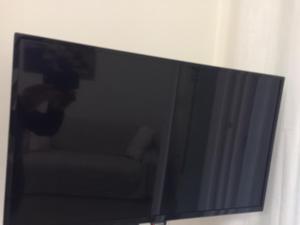A television and/or entertainment centre at Residenza Sant'Orsola Azzurra Mazzini