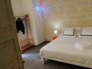 Postel nebo postele na pokoji v ubytování Le Luminarie B&B