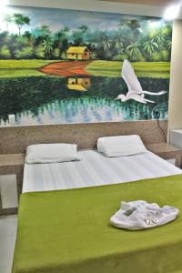 Ένα ή περισσότερα κρεβάτια σε δωμάτιο στο Hotel Farol da Barra