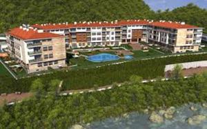 an aerial view of a resort with a swimming pool at Apartamento Jardines del Sella in Cangas de Onís