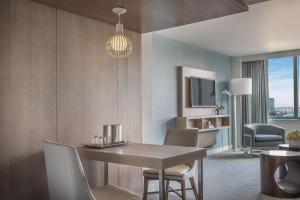 a dining room with a table and chairs in a room at Hyatt Regency Jacksonville Riverfront in Jacksonville