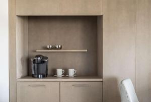 a kitchen with a coffee maker and two cups at Hyatt Regency Jacksonville Riverfront in Jacksonville