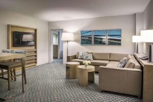 a living room with a couch and a table at Hyatt Regency Jacksonville Riverfront in Jacksonville