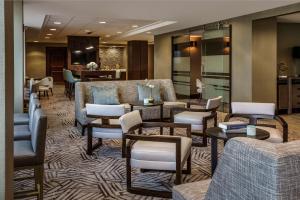 a lobby with couches and tables and chairs at Hyatt Regency Jacksonville Riverfront in Jacksonville
