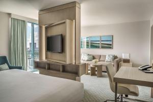 a hotel room with a bed and a tv at Hyatt Regency Jacksonville Riverfront in Jacksonville