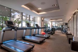 a gym with a row of treadmills and machines at Hyatt Ahmedabad in Ahmedabad