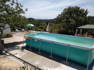 a pool in the backyard of a house at Quinta da Mesa in Macinhata do Vouga