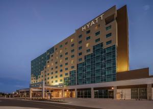 a large building with a lot of windows at Hyatt Regency Aurora-Denver Conference Center in Aurora