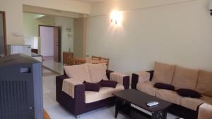 Ruang duduk di Lumut Valley Resort Condominium