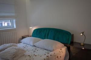 Postel nebo postele na pokoji v ubytování Zen & Art suite