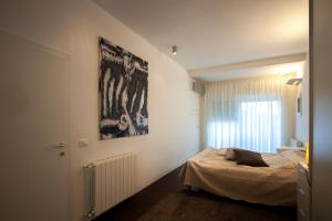 Postel nebo postele na pokoji v ubytování Zen & Art suite