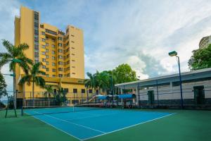 a tennis court in front of a building at Halong Pearl Hotel in Ha Long