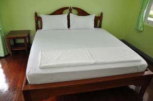 Postel nebo postele na pokoji v ubytování Poon Suk Resort Prachinburi