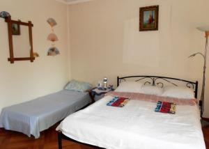 Postel nebo postele na pokoji v ubytování Guest House Marketti