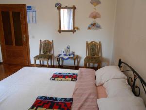 Postel nebo postele na pokoji v ubytování Guest House Marketti