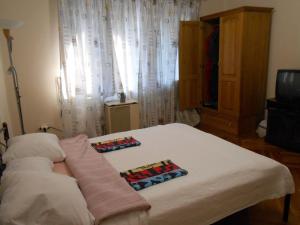 Postel nebo postele na pokoji v ubytování Guest House Marketti