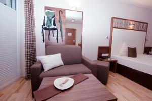 Postel nebo postele na pokoji v ubytování Hotel Jennys Schlössl
