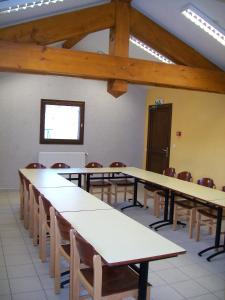 a large room with tables and chairs in it at Gîte Le Shantoné in Saint-Michel-de-Maurienne