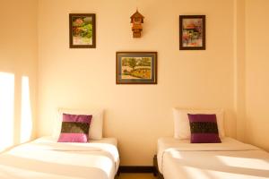 Postel nebo postele na pokoji v ubytování Shanti Boutique Hotel