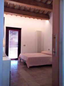 Postel nebo postele na pokoji v ubytování Agriturismo Forestale Luti